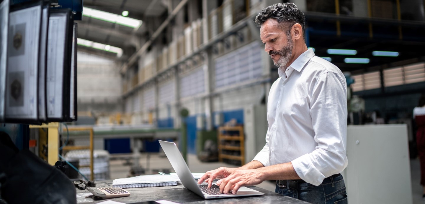 man in front of desk working man in front of desk working
