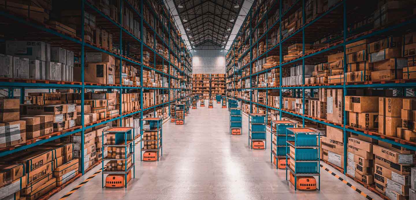 Large distribution centre packed with boxes ready to be shipped. Large distribution centre packed with boxes ready to be shipped.
